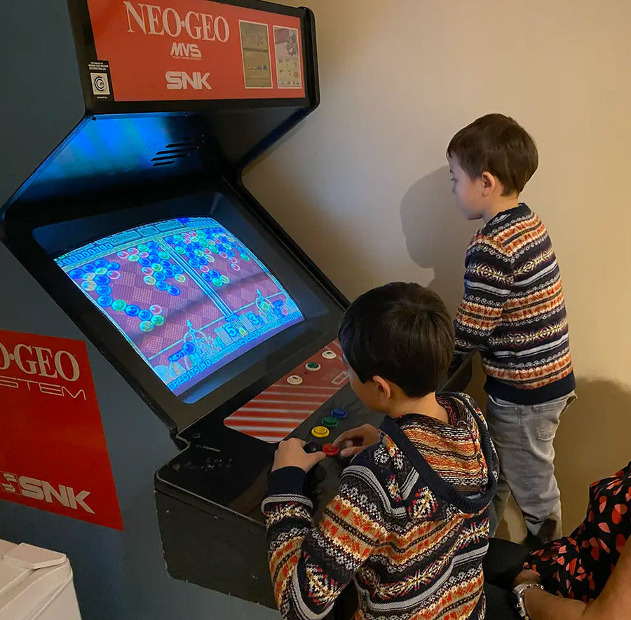 Kids playing arcade games